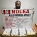 NDLEA officers and recovered cocaine wraps at Enugu Airport